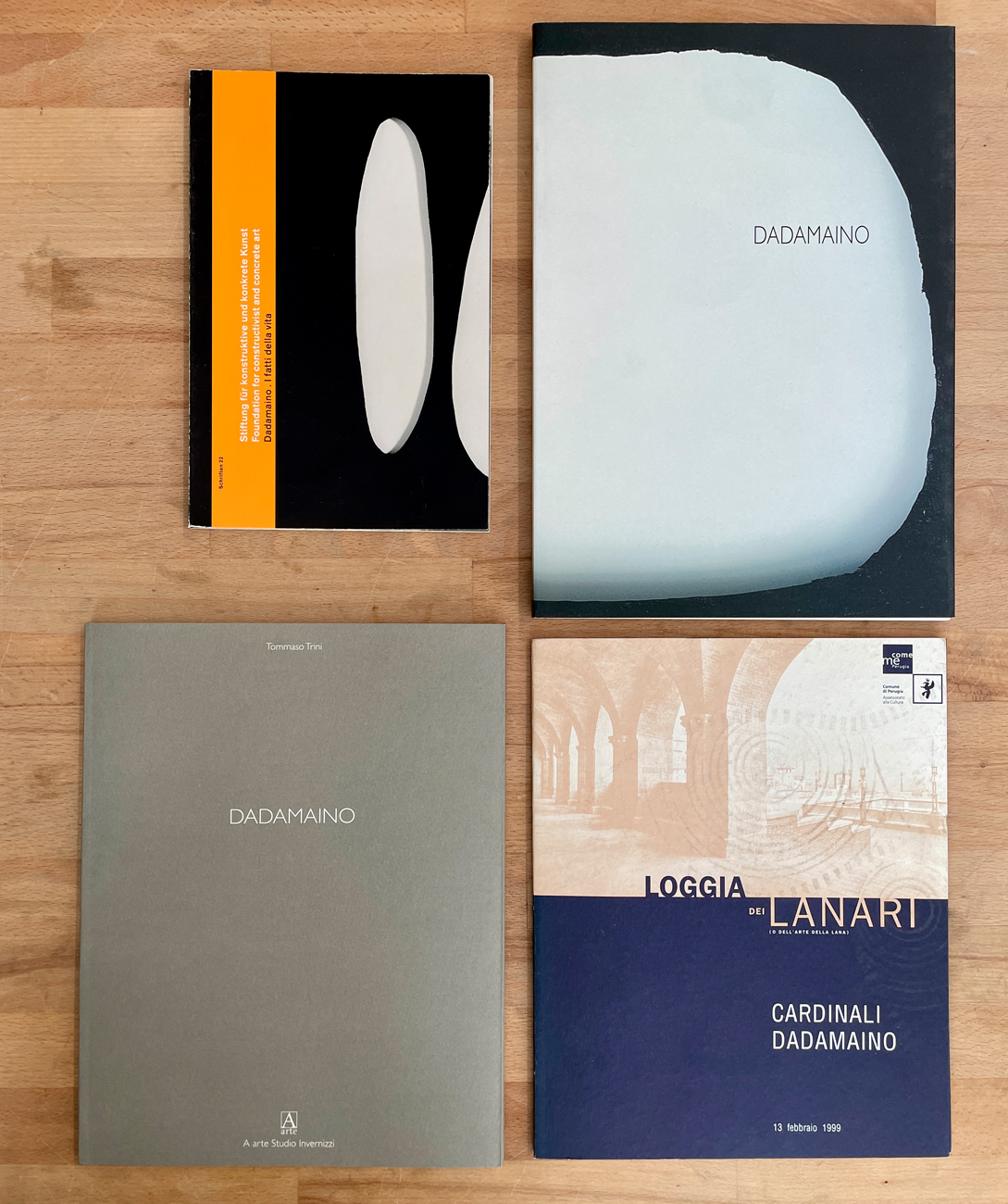 DADAMAINO - Lotto unico di 4 cataloghi, di cui uno autografato